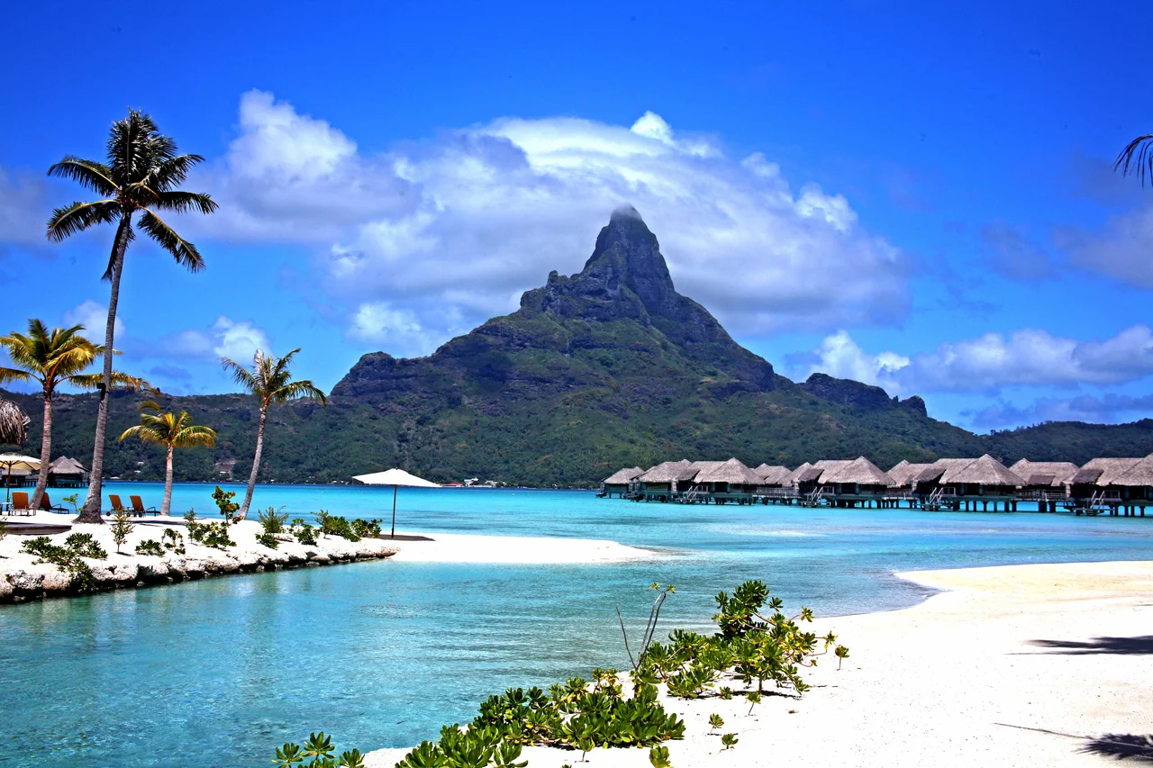 A Bora Bora lagoon shoreline and resort setting facing Mount Otemanu